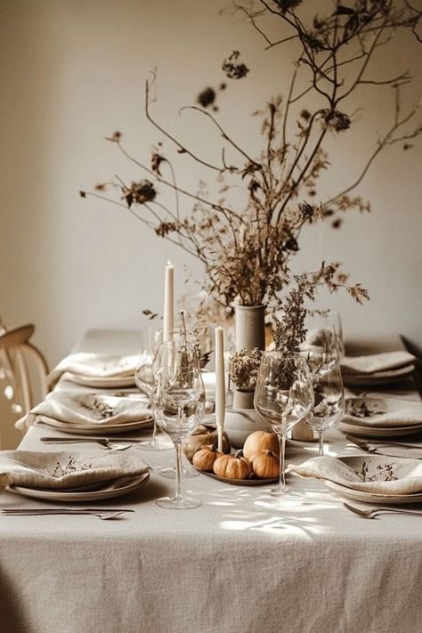 Create a serene and elegant holiday table with a minimalist Thanksgiving tablescape featuring neutral tones and simple accents. #MinimalistThanksgiving #NeutralDecor Neutral Tablescape, Modern Thanksgiving Table, Minimalist Thanksgiving, Chic Table Settings, Modern Table Decor, Modern Thanksgiving, Modern Table Setting, Thanksgiving Tablescape, Chic Table