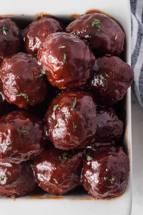 These sweet and savory Grape Jelly Meatballs are an easy appetizer for any occasion. A few simple ingredients - THREE to be exact, and very little prep, make them perfect for holidays and game days! Crockpot Grape Jelly Meatballs, Meatballs Grape Jelly, Meatball Appetizer Crockpot, Meatballs Appetizer, Cocktail Meatball Recipes, Grape Jelly Meatballs Recipe, Meatballs Crockpot, Jelly Meatballs, Grape Jelly Meatballs