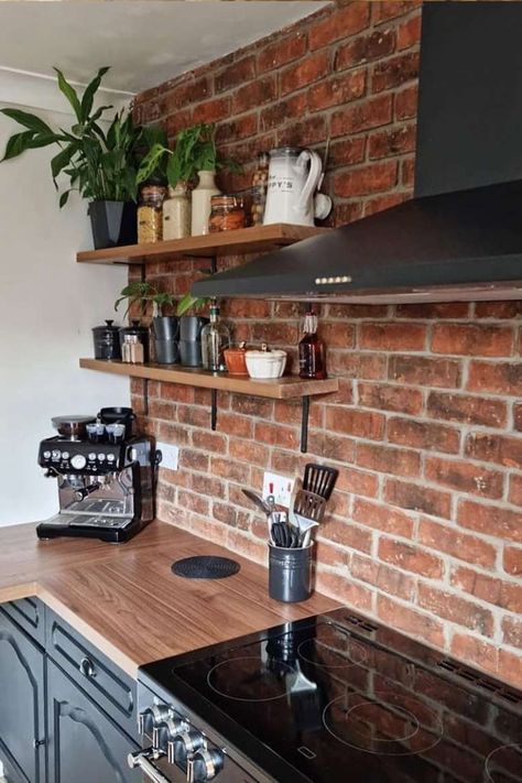 Kitchen with brick wall