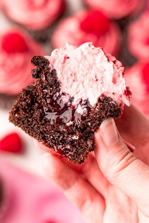 These Chocolate Raspberry Cupcakes have a raspberry-filled center that are topped with a light and fluffy raspberry vanilla cream frosting! Serve these delicious cupcakes to friends and family in under 35 minutes! Chocolate And Raspberry Muffins, Chocolate And Raspberry Cupcakes, Choc Raspberry Cupcakes, Raspberry Chocolate Lava Cupcakes, Raspberry Cupcakes Filling, Dark Chocolate Raspberry Cupcakes, Chocolate Cupcakes With Raspberry Filling, Raspberry Swirl Cupcakes, Gourmet Halloween Cupcakes