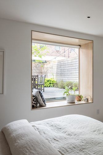 Rather than live with the architectural flaws of their developer-renovated duplex, these Brooklyn homeowners decided a redo of the redo was a must. The pair hired vonDALWIG Architecture to tweak the improvements, to bring more light into their home, and to create better flow. #AiryDesign #Airy #WindowSeat #BedroomWindow #WhiteOak #ReadingSeat #ReadingNook #BuiltIn #BuiltInStorage #BedroomStorage Window Reveal, Pale Wood, Malibu Beach, Fancy Houses, Duplex House, Primary Bedroom, Bedroom Windows, Project Inspiration, House Hunting