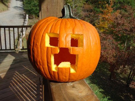 Here's an idea for all you Minecraft fans! Why not carve a creeper pumpkin? All you need to cut is squares and rectangles, which makes it super easy and super fun. Pumpkin Carving Ideas Ghost Face, Minecraft Jack O Lantern, Minecraft Carved Pumpkin, Minecraft Pumpkin Carving, Creeper Pumpkin, Silly Pumpkin, Minecraft Pumpkin, Ghost Photoshoot, Cute Pumpkin Carving