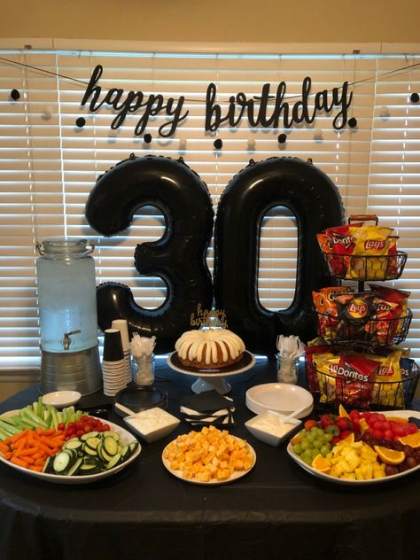 Simple and pretty 30th birthday party snack table and photo back drop Party For Him Men Birthday Ideas, Simple Party Decorations For Men, Dirty30 Birthday Ideas For Men, Big 30th Birthday Party Ideas, Outside 30th Birthday Party Ideas, Birthday 30 Men Decor, Husband Birthday Table Decor, Table Decoration For Men Birthday, 30th Husband Birthday Ideas