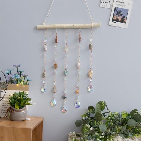 PRICES MAY VARY. Natural Crystal: Our natural crystal is carefully selected and cut to create a stunning and unique ornament that will add a touch of elegance to any room in your home. DIY Wooden Wall Hanging: The ornament comes with a wooden base and all the necessary hardware for easy assembly and hanging. You can customize the length and shape of the crystal to suit your preferences. Versatile Decor: The crystal ornament is perfect for decorating living rooms, bedrooms, dining rooms, kitchens Hanging Crystals Diy, Crystal Suncatchers Swarovski, Diy Wooden Wall, Bar For Home, Window Charm, Home Decor For Living Room, Kitchen Wall Hangings, Stil Boho, Hanging Crystals