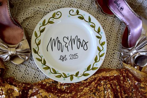 This personalized Mr & Mrs plate makes the perfect gift and/ or decor for any bridal shower, wedding or anniversary. Each plate is hand painted with the special couple in mind.  Details:  - 8 inch salad size plate - hand painted  - personalized  - dishwasher safe, hand wash recommended (to ensure the longevity of the piece) Personalization:  Please put the year that you would like on your plate in the personalization box. Looking for a different style? Check out our other listings! Painted Wedding Plate, Wedding Plates Ideas, Plate Wedding Decor, Wedding Plate Setting, Wedding Cake Plates, Wedding Plate, Plate Setting, 2025 Wedding, Aesthetic Diy