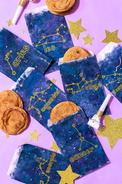 Make a set of zodiac treat bags with Cricut Joy! #ad Cricut is the perfect tool for drawing complex designs like the zodiac signs on galaxy-inspired treat bags for any space-themed party or event! Use paint to quickly create a galaxy pattern, and finish the treat bags with Cricut Joy Markers for personalization. Finally, cut out glittery stars to add to your celebration! // #cricutmade #cricutjoy #cricut #cricutideas #cricutmarkers #zodiacparty #galaxycrafts #partycrafts #papercrafts #galaxypain Zodiac Sign Crafts, Zodiac Crafts, Constellation Craft, Cricut Joy Machine, Astrology Decor, 21st Ideas, Library Work, How To Use Cricut, Gift Bags Diy