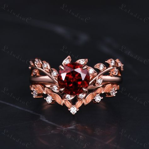 6mm round cut Antique Red Garnet Leaf Engagement Ring Set Rose Gold Moissanite Twig Wedding Ring Art Deco Branch Bridal Promise Ring Unique Women Gift Side stones: moissanite This ring can also be made in genuine solid 10k, 14k, 18k gold or Platinum, and all the rings in my shop can be customized too! If you want to know more details about the ring, just contact with me anytime! If you want to customize the ring, just contact with me anytime! If you want to make a custom jewelry, just contact with me anytime! PROCESS TIME AND SHIPPING It usually takes about 3-4 weeks to finish the ring and 4-6 days to deliver to you if you are in US. (Free Shipping within US!) We will offer you the tracking number once your ring is shipped. WARRANTY 30 days money back guarantee! If you have any questions, Red Garnet Engagement Ring, Red Wedding Rings, Ruby Engagement Ring Gold, Red Engagement Ring, Gold Art Deco Ring, Wedding Ring Art, Garnet Engagement Ring, Black Gold Ring, Engagement Rings Princess