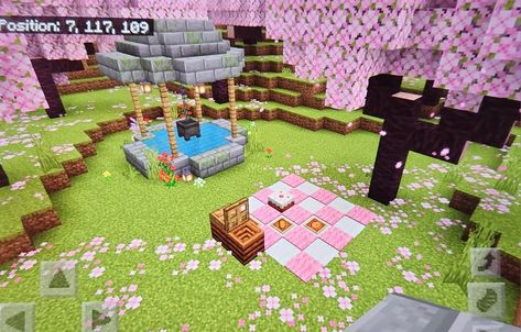 cottagecore wishing well & picnic area under the cherry blossom trees 🌸🩷 Cute Well Minecraft, Cherry Tree Minecraft Ideas, Cherry Blossom Picnic Minecraft, Cherry Blossom Well Minecraft, Cherry Blossom Dock Minecraft, Cherry Blossom Decorations Minecraft, Minecraft Cherry Bedroom, Cherry Blossom Storage Room Minecraft, Cherry Blossom Pathway Minecraft