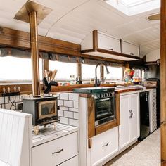 Van Conversion Kitchen, Short Bus Conversion, School Bus Tiny House, School Bus Camper, School Bus House, House Ceiling, Bus Living, Short Bus, Diy Camper Remodel