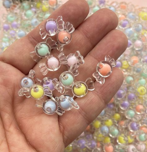 These are clear candy colored assorted candy beads. These chunky taffy beads are approx. 9x17mm with a 2mm hole. You will get 30 assorted candy beads. Check out the rest of our pastel beads here! https://www.etsy.com/shop/HappyKawaiiSupplies?ref=hdr_shop_menu&search_query=pastel+beads Diy Kids Crafts, Candy Beads, Pastel Goth Art, Pastel Beads, Bridal Shower Inspiration, Goth Art, Cute Birthday Cakes, Chunky Beads, Beads Diy