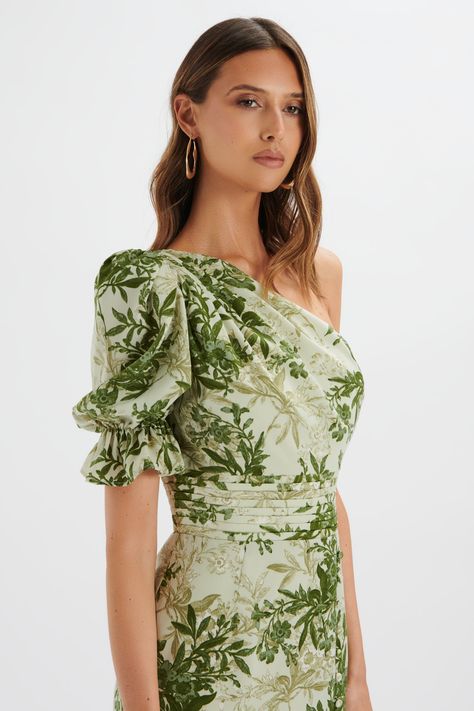 Incorporate floral elegance into your summer wardrobe with the NAKIA Asymmetric Puff Sleeve Midi Dress. Featuring an eye-catching botanical print and an asymmetric puff sleeve, this midi dress effortlessly combines style and comfort. The front split adds a touch of elegance, making it the perfect summer edition to your Floral Dresses Bridesmaid, Botanical Dress, Puff Sleeve Midi Dress, Lavish Alice, Sleeve Midi Dress, Botanical Print, Printed Midi Dress, Botanical Prints, Perfect Summer