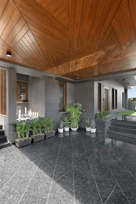 Modern Residence With Ethnic-Contemporary Interiors | Jihan Associates - The Architects Diary Car Porch False Ceiling Design, Car Porch Ceiling Design, Parking Tiles Design Indian, Kota Flooring, Parking Tiles Design, Floor Pattern Design, Entrance Corridor, Parking Tiles, Car Porch