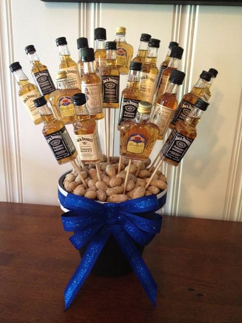 a centerpiece with small alcohol bottles on skewers 20s Christmas, Birthday Party Ideas For Men, 50th Birthday Party Ideas For Men, 50th Bday, Ge Bort, Mens Birthday Party, Birthday Inspo, Beer Birthday, 50th Party