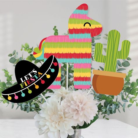 Let's Fiesta Centerpiece Sticks INCLUDES 15 Let's Fiesta table toppers in three different shapes, 15 sticks and stickers for easy assembly. Fiesta party table decorations are perfect for a Cinco do Mayo party. Let's Fiesta Party Centerpiece Sticks SIZE five Piñata table toppers, 8.5" wide x 10.5" tall; five Cactus table toppers, 4.25" wide x 8" tall; and five Sombrero table toppers, 7.5" wide x 5" tall. The unique design and variety of pieces makes this table decoration kit an impressive additio Mexican Centerpiece Ideas, Fiesta Party Centerpieces, Fiesta Table, Mexican Fiesta Party, Birthday Bbq, Fiesta Theme Party, Mexican Party Theme, Party Tables, Party Centerpiece