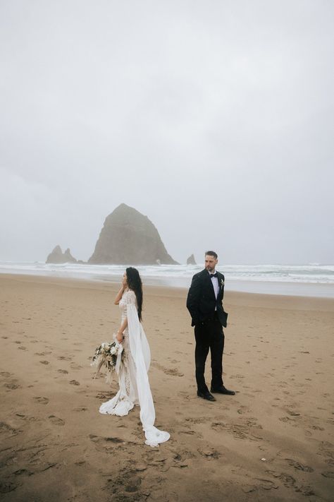 overcast windy seaside oregon wedding photos on cannon beach elopement bohemian wedding vibes white bouquet lace bridal gown sandy beach pacific northwest elopement photographer emily jenkins photo #pnw #pnwwedding #pnwelopement #cannonbeach #cannon Beach Elopement Bouquet, Cannon Beach Oregon Wedding, Cannon Beach Couple Photos, Acadia Elopement, Cannon Beach Wedding, Oregon Style, Elopement Styled Shoot, Seaside Oregon, Styled Shoot Ideas