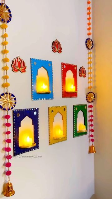 Blenders Pride Bottle Art, Diwali Pooja Backdrop Ideas, Aesthetic Diwali Decor Diy, Hangings For Diwali Decoration, Diy Diya Stand For Diwali, Diwali Wall Hanging Ideas, Diya Stand Diy, Diy Paper Lanterns Hanging, Diwali Decorations At Home Entrance Door