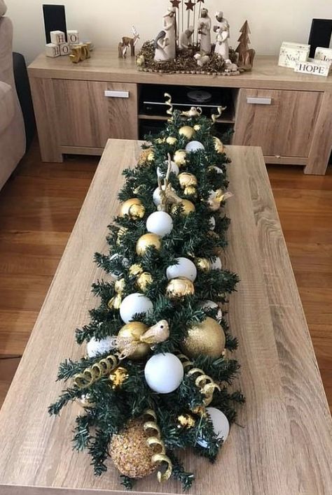 This crafty person used a pool noodle as their base and placed all of this fun holiday decopage on top with a hot glue gun! https://www.pioneerfamilypools.ca/products/pool-noodle/ Pool Noodle Christmas Wreath, Centrepiece Christmas, Wooden Christmas Trees Diy, Christmas Centrepieces, Christmas Centrepiece, Dekoratívne Vence, Diy Christmas Table, Christmas Wreaths Diy Easy, Tafel Decor