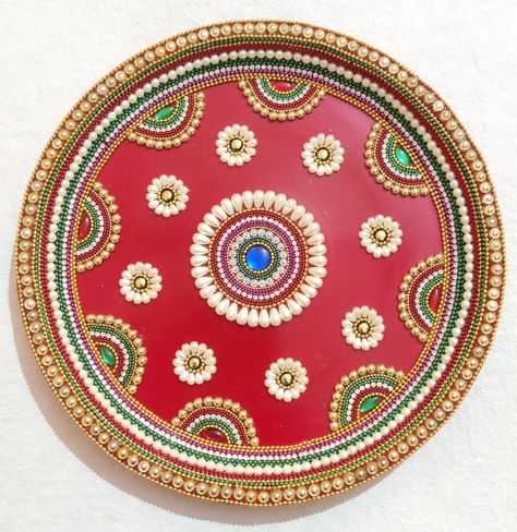 Diy Puja Thali. How to make Decorative Puja Plate. For order contact me on 7066765582. #sainagiftsnglitz #pujaplate #handmade #decorated #like #follow #share #pujathali #red #exclusive #order #youtube #crafting #followmypage #likes Diy Puja Thali, Harathi Plate Decoration Ideas, Aarti Plate Decoration, Decorative Plates Diy, Aarti Decoration, Thali Ideas, Thali Design, Wooden Decoration Ideas, Engagement Basket