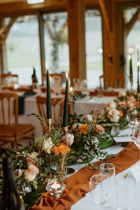 Terracotta And Green Centerpieces, Burnt Orange Table Runner Wedding, Green And Burnt Orange Wedding Theme, Orange Reception Decor, Sage Green And Burnt Orange Wedding Bouquet, Dark Orange And Sage Green Wedding, Centerpieces Wedding Burnt Orange, Green And Orange Wedding Table Decor, Burnt Orange Centrepiece