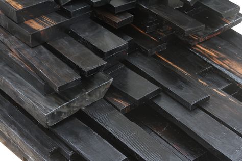 From equatorial Africa, Ebony is usually found in wet lowlands near rivers and swaps. Devoid of color, Ebony has ink black with lighter streaks. Only a small percentage of Ebony (three to five percent) produce the highest quality jet black color. Most pieces contain 50-70% sapwood with deep heart checks and voids in the heart with fall off of 80-90%. Ebony is hard and costly to produce, which makes it a rare species to obtain. Ebony Wood Furniture, Dark King, Baye Fall, Jet Black Color, Got Wood, Rare Species, Resin Furniture, Ebony Wood, Wooden Art