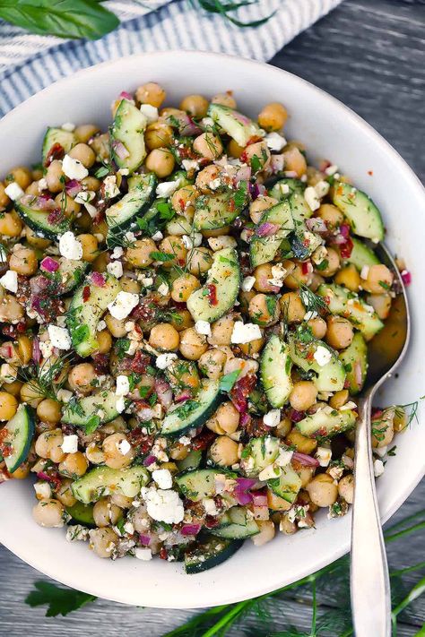 This chickpea salad with feta, cucumbers, sun dried tomatoes, and herbs is packed with healthy Mediterranean flavor, and it only takes 10 minutes! It's the perfect light vegetarian main or side (vegan optional). Salad For Buffet, Chickpea Feta Cucumber Salad, Chickpea Cucumber Feta Salad, Feta Salad Recipes, Chickpea Salad With Feta, Healthy Potluck Recipes, Chickpea Feta Salad, Mediterranean Bowl, Cucumber Feta Salad