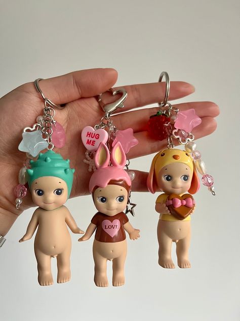 Authentic Sonny Angel Keyrings handmade by me ❤️  Perfect to hang onto your bag 💼 Custom Sonny Angel with your choice of charms! 🫶 If you would like dangly charms please select heart clasp 🎀 All variations will come with 2 charms of your choice or leave it up to me ❤️ Feel free to message me for any other enquires! Five Below Toys, Sonny Angel Marine Series, Sonny Angel Bag Charm, Stuff To Add To Your Wishlist, Cherry Sonny Angel, Custom Sonny Angel, Sonny Angel Art, Girly Presents, Aesthetic Items To Buy