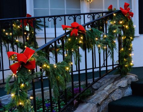 How To Decorate A Deck For Christmas, Christmas Front Porch Railing Decor, Garland On Outdoor Railing, Christmas Deck Railing Decorating Ideas, Outdoor Railing Christmas Decorations, Christmas Railing Decor Outdoor, Garland On Porch Railing, Garland Porch, Xmas Stairs