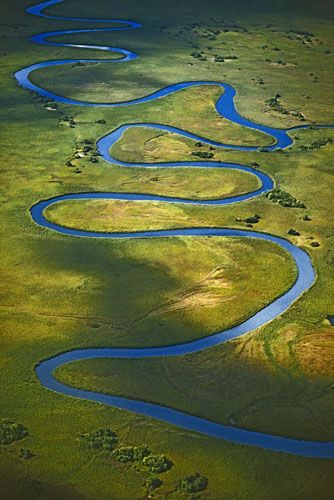 It sometimes forms meanders so wide that the water flows across the channel as much as it does downstream High Vocabulary, Botswana Travel, Frans Lanting, Word Definition, Chobe National Park, National Geographic Photographers, Everyday English, Okavango Delta, Landlocked Country