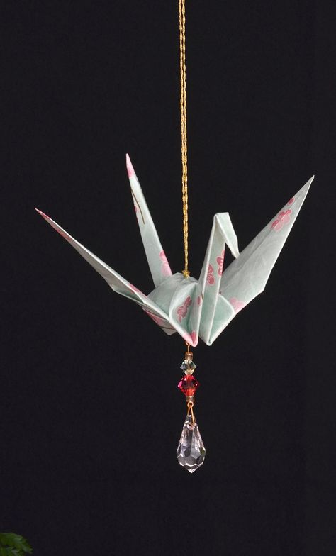 "Very unique, decorative accent symbolizing peace, hope and good fortune. These handcrafted suncatchers are made from Japanese paper, and are perfect for gift giving.  In Japan, it is fabled that the crane has a life span of one thousand years. Known to mate for life, the crane has long been regarded as a symbol of fidelity, longevity and good fortune. In modern days, the origami crane is also a popular symbol of peace and hope.  My origami crane suncatchers are designed to evoke a sense of calm Japanese Diy Decorations, Origami Crane Mobile, Paper Crane Decor, Origami Aesthetic, Paper Crane Origami, Paper Crane Mobile, Origami Japanese, Crane Mobile, Origami Mobile