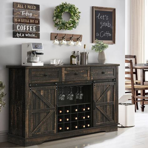 PRICES MAY VARY. RETRO FARMHOUSE DESIGN: The buffet sideboard combines retro dark rustic oak color panels with wood grain texture, and paired rustic barn door with black metal handles, which create a elegant, charming rustic flair. It could blends with any furniture decor and makes your home more beautiful. AMPLE STORAGE SPACE: This sideboard buffet is equipped with 3 drawers and 2 storage cabinets to meet your kitchen storage needs; it is equipped with 15 wine racks and 3 glass racks to meet wi Black And Oak Cabinets, Farmhouse Wine Bar, Dining Room Dark, Rustic Coffee Bar, Farmhouse Buffet Cabinet, Kitchen Buffet Cabinet, Bar Nook, Coffee Bar Cabinet, Farmhouse Sideboard Buffet