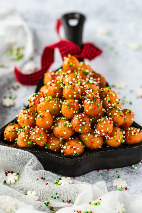 Struffoli Italian Honey Balls are deep fried morsels of dough coated in a honey syrup. They're an Italian traditional dessert during the holidays. #struffoli #italiandessert #traditionalitalian #dessert #honeydessert Mostaccioli Cookies Recipe, Honey Balls Recipe, Italian Honey Balls, Struffoli Recipe, Honey Balls, Pasta Fish, Pasta Italy, Italian Rainbow Cookies, Honey Dessert