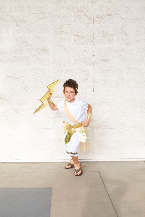 One of my favorite family costumes to date was Greek gods! Create this DIY Zeus costume for Halloween for kids or adults. It's easy to make and easy to wear. This tutorial also features an easy Poseidon costume, Athena costume, and Cupid costume! Ancient Greek Diy Costume, Diy Zeus Costume, Diy Toga Costume For Kids, Zeus Costume Diy, Greek Costume Diy, Greek Gods Costume, Cupid Costume Diy, Zeus Costume, Poseidon Costume