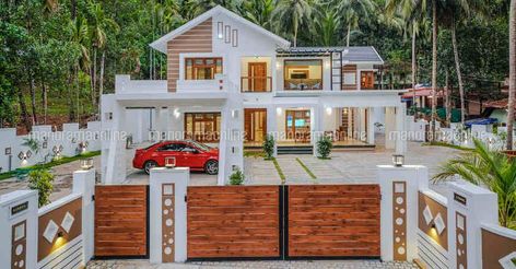 luxury-fusion-house-calicut Kerala Homes, Car Porch, Kerala Home, Boundary Wall, Beautiful Landscaping, Luxury Mansion, Gate Designs, Brick Fence, Budget Design