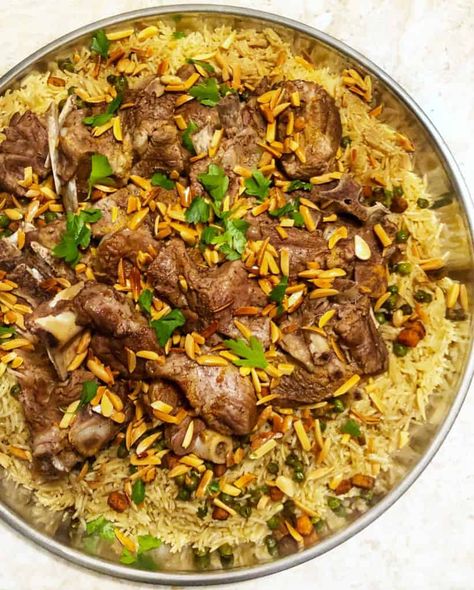 Hey friends! Long time no see. Sorry, I have been MIA. It has been a hectic few weeks for me. I dedicated a lot of my spare time to my E-cookbook which you guys seem to love and now since it is Ramadan; often I am busy. I made this rice dish the other day... Arabic Lamb And Rice, Lamb And Rice Middle Eastern, Lebanese Lamb Rice, Lamb With Rice Recipe, Dishes For Ramadan, Ouzi Recipe Arabic Food, Meat With Rice Recipes, Halal Lamb And Rice Recipe, Lamb Rice Recipes