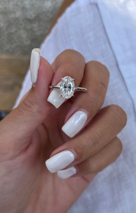 🎁We have extended our returns and exchange policy: Contact Us within 14 days of delivery Ship items back within 30 days of delivery 2 Carat Oval Solitaire Moissanite Engagement Ring, low profile setting, 14\18k solid gold unique GioielliRings design makes a regal statement that is bound to become a family heirloom. MORE INFORMATION ❥ The craft period is about 10-14 business days. ❥ Free shipping via DHL ❥ Available in a combination of 14kt, 18kt  Rose Gold, Yellow Gold, White Gold ❥ Arrives in our box, ready for gift-giving (and proposing ) ❥ GioielliRings MAIN STONE  Type: Moissanite   Size: = 10.5x7 2ct approx  Shape: oval  Color: DF /VVS SIZING Ring Sizes range from 4-9 US.  If you have any questions about sizing, please do not hesitate to reach out! Cute Engagement Rings, Oval Engagement Ring, Future Engagement Rings, Moissanite Engagement Ring Solitaire, Oval Moissanite, Oval Engagement, Engagement Ring White Gold, Dream Engagement, Dream Engagement Rings