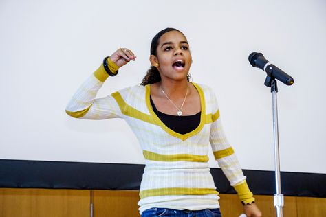 When Girls Spit: The Power of Spoken Word. Encouraging young women of color to express their experiences creatively through spoken word can empower them. Black Poets, Word Poetry, School Assembly, School Assemblies, Spoken Word Poetry, Slam Poetry, Spoken Words, Words Matter, Student Reading