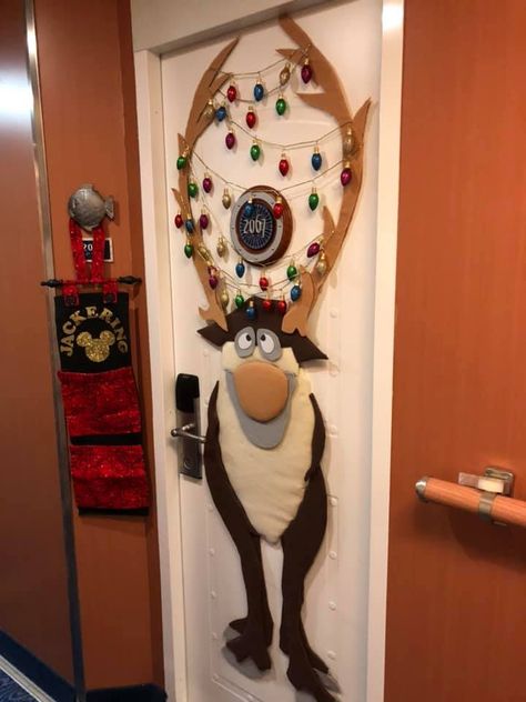 Frozen's Sven Cabin Door for our Christmas Cruise - felt covered, padded cardboard pieces with glitter "lights" garland in the antlers. I wanted something unique that was packable and reusable. It was a big hit!  It was inspired by the graphic from "Frozen Ever After" of Sven with his antlers tangled in lights. Disney Window Decoration, Frozen Christmas Decorations, Preschool Door Decorations, Cabin Door Decorations, Door Christmas Decorations, Cruise Door Decorations, Disney Cruise Door Decorations, Diy Christmas Door Decorations, Disney Characters Christmas