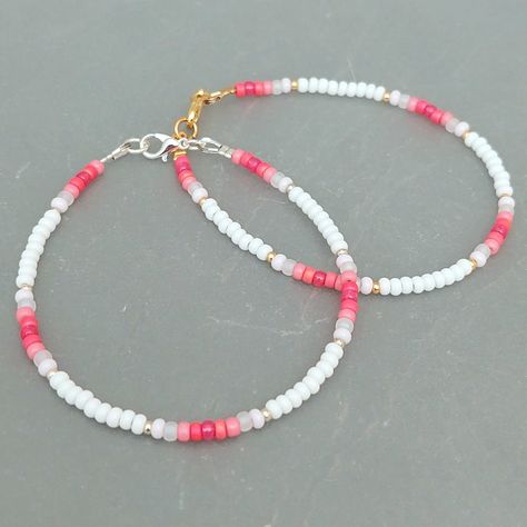 This pink summer seed bead bracelet has been lovingly made using good quality colourful 3mm glass Miyuki and Preciosa seed beads in pinks and white. Available with either 2mm silver or gold Miyuki seed beads to highlight. Threaded on strong stainless steel 7 strand Tiger Tail wire and finished with silver / gold plated wire guardians, a trigger clasp and optional extender chain. Matching necklace available on request. Matching Anklet available on request. More colours and designs can be found at: https://www.etsy.com/uk/shop/CraftHutCornwall BRACELET LENGTHS 6 1/2" Small 7"       Ladies - Small 7 1/2" Ladies - Standard (this is the most common size and generally the size most bracelets are made) 8"       Ladies - Standard Large / Mens - Standard 8 1/2" Ladies - Large / Mens - Standard Larg Pink Beaded Anklet, Pink Seed Bead Bracelet Ideas, Bracelet Ideas With Small Beads, Seed Bead Inspiration, Anklet Bead Ideas, Bracelet Beads Design, Simple Seed Bead Bracelets, Bracelet Ideas Small Beads, Seed Beads Bracelets Ideas