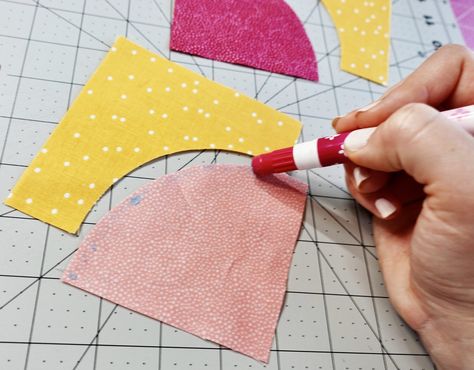 use a glue stick to baste curved fabric pieces together before sewing perfect curves. Learn how to sew curves perfectly every time with this easy quilting tutorial filled with quilting tips & tricks! A curved piecing quilting project is a great next challenge for your patchwork & quilting sewing ideas! Sewing Circles On Quilts, Sewing Curved Quilt Pieces, How To Sew Circles Quilt Blocks, Quilting Curved Piecing, Curved Piecing Tutorial, How To Sew Curves In Quilts, Sewing Curves Tutorial, Sewing Curves In Quilting, Quilts With Curved Piecing