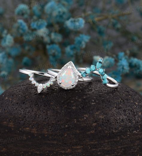 Pear shaped opal bridal set Art deco engagement ring Moissanite/Diamond ring Vintage white gold Promise prong set Anniversary turquoise band https://www.etsy.com/shop/BrilliantRing?ref=l2-shopheader-name -------------------Specifications---------------------- engagement ring Center Stone - 8mm*6mm Natural Opal Side stones: 0.1ct Natural Diamond/ Moissanite The Width of the Band - 1.65mm The Thickness of the Band - 1.2mm Weight of gold - 2.56g wedding band1 Stone -0.3ct turquoise The Width of the Turquoise Ring Engagement Western, Diamond Engagement Ring With Opal Accent, Silver And Turquoise Engagement Ring, Pear Opal Engagement Ring, Opal And Turquoise Ring, Turquoise Diamond Wedding Rings, Opal And Turquoise Engagement Ring, Torquise Wedding Ring, Western Engagment Rings