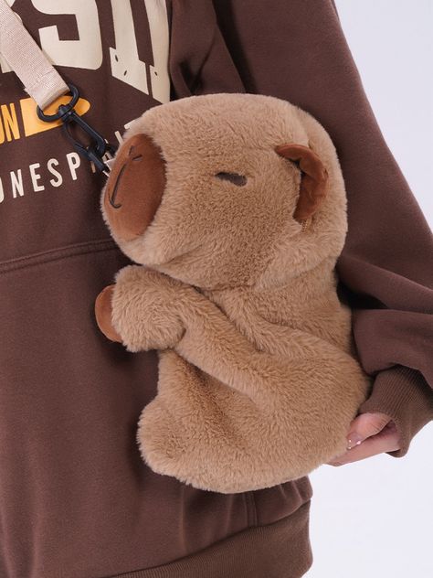 Embrace the charm of the world's largest rodent with our khaki cute capybara plush bag! This delightful accessory is available in two convenient sizes, 23cm or 28cm, making it perfect for both kids and adults who adore kawaii fashion. Can be worn as a backpack or a crossbody bag, offering flexibility for different occasions. Features adjustable straps to ensure a comfortable fit for all body types.  Whether you're heading to school, a casual outing, or a fun day out, this khaki bag is the perfec Capybara Clothes, Capybara Plushies, Capybara Plush, Backpack Art, Cute Capybara, Plush Bags, Plush Backpack, New Caledonia, Fun Day