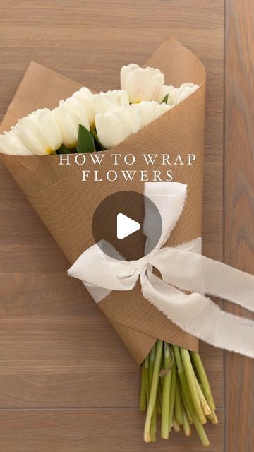 THE SUFFOLK NEST Ashlee Jane on Instagram: "How to easily wrap flowers 🤍 One to save for when you gift flowers to a loved one. #wrappingflowers #whiteflowers #tulipseason #springblooms #springflowers #tulips #tuliplove #wrapping #diywrapping #giftwrapping #giftwrap #giftwrappingideas #giftwrappingskills" How To Give Flowers As A Gift, How To Wrap Flowers In Brown Paper Bag, Spring Gift Wrapping Ideas, Paper To Wrap Flowers, Craft Paper Flower Wrapping, Flower Arrangement With Tulips, Wrapping Flowers With Paper, Paper Wrapped Flowers Bouquets, Brown Wrapped Flowers