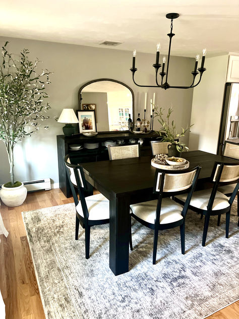 This beautiful dining room features pottery barn table and sideboard, birchlane chairs and a shades of light chandelier.  Love all the decor we added from homesense, target and magnolia. Dining Room Decor Dark Table, Black Dining Room Table Decor Ideas, Dining Room With Black Table, Black Dining Room Table Decor, Black Dining Table Decor Ideas, Black Dining Room Table, Pottery Barn Table, Barn Table, Room Table Decor