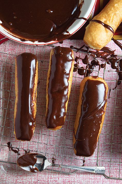 Eclair (Long Johns) Recipe | SAVEUR Chocolate Eclairs, Eclair Recipe, Doughnut Recipe, Long John, Chocolate Glaze, Long Johns, Cream Puffs, Donut Recipes, Eclairs