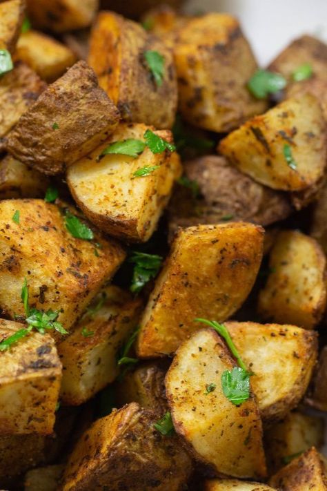 Crispy Roasted potatoes seasoned with spices and fresh parsley. Yellow Idaho Potato Recipes, Roasted Potatoes Russet, Roasted Russet Potatoes, Crispy Oven Roasted Potatoes, Potato Recipes Crockpot, Russet Potato Recipes, Potato Ideas, Cheesy Scalloped Potatoes Recipe, Easy Scalloped Potatoes Recipe