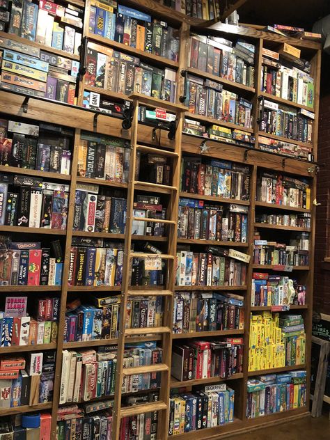 Game Store Aesthetic, Board Game Library, Bookshelves Board Games, Boardgame Cafe Interior, Vintage Bookshelf Board Games, Board Game Store, Board Game Cafe, Board Game Room, 2024 Books