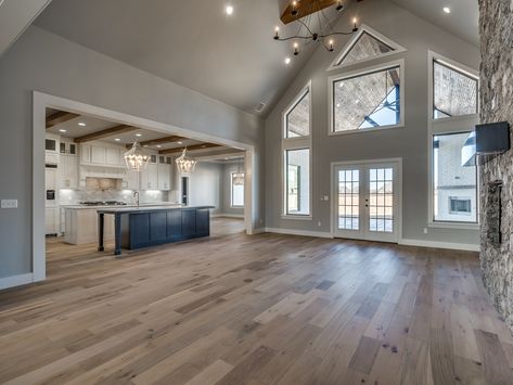 Barndominium Cathedral Ceiling, Cathedral Ceiling Open Floor Plan, House Plans With Vaulted Great Room, Living Room Cathedral Ceiling Ideas, Back Of House Extension, Barndominium Flooring Ideas, Farmhouse Open Floor Plan Interior, Modern Farmhouse Great Room Ideas, High Ceiling Farmhouse