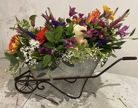 A wheelbarrow full of flowers for a keen gardner @carolinepolden Crate Decor, Flower Displays, Barrel Decor, Flower Display, Easter Wreaths, Floral Centerpieces, Easter Crafts, Silk Flowers, Floral Arrangements