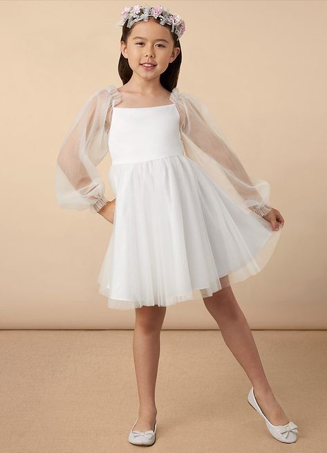 Aya will perfectly fit every flower girl and every wedding theme. Cut from tulle, her clean bodice is framed with long blouson sleeves with ruffle cuffs. The A-line skirt flows with every step and a bow rests at the back waist. Flower Girl Dresses With Sleeves, Special Event Dresses Parties, Flower Girl Dresses White, Flower Girl Dress White, Flower Girl Dresses Vintage, White Dress Formal, Wedding Dresses For Kids, Military Ball Dresses, Ivory Flower Girl