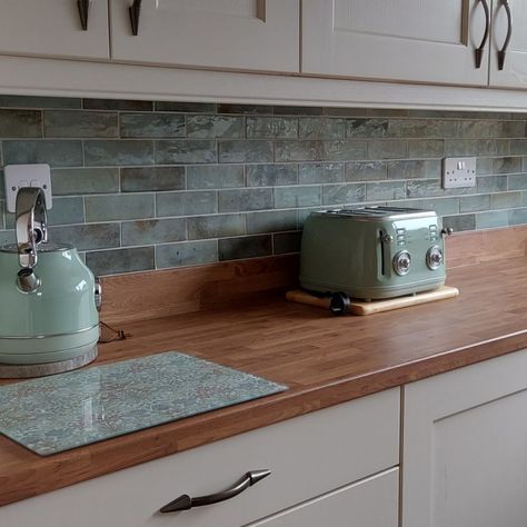 Colour co-ordination is on point! Our Cabana light green tiles create the perfect feature wall for your kitchen or bathroom 💚 #GreenTiles #WallTiles #NewTiles Grey Kitchen Green Tiles, Coloured Tiles Kitchen, Coloured Kitchen Tiles, Colourful Tiles Kitchen, Kitchen With Green Tiles, Kitchen Green Tiles, Green Tiles Kitchen, Azulejos Kitchen, Kitchen Wall Colour Ideas